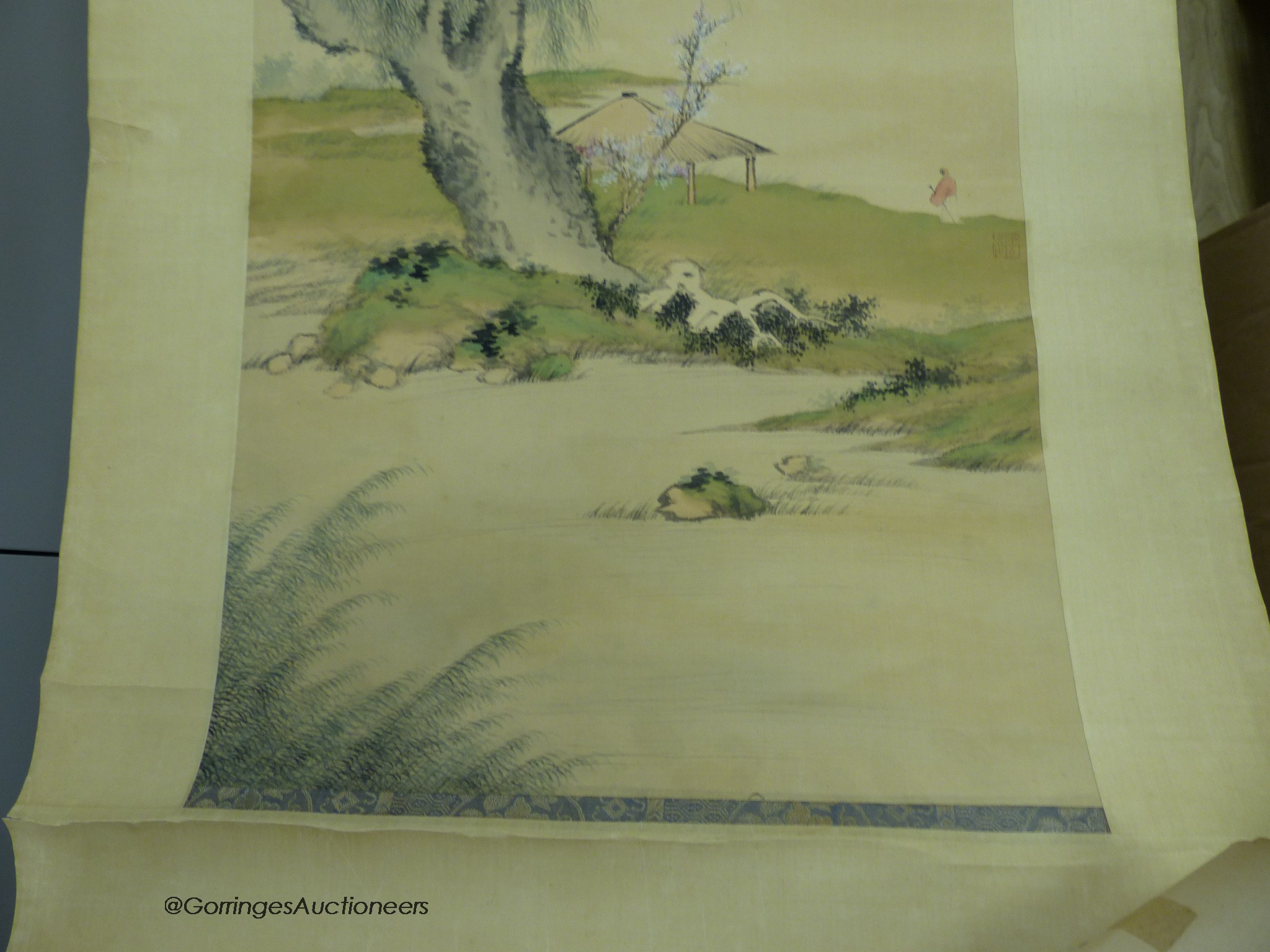 Two late 19th century Chinese scroll paintings, sage in a landscape and buildings in a landscape